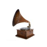 Horn gramophone a continental horn gramophone with Saturn soundbox, oak-grained fluted metal horn