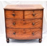 A Victorian mahogany bow fronted chest of drawers, having two over two drawers, on bun feet, AF