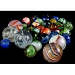 A collection of Edwardian and later marbles, including a late Victorian/Edwardian example, in