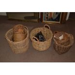 A collection of Whicker baskets, including bread, washing and larger examples, together with a