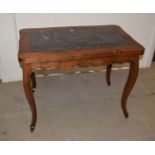 A modern reproduction Louis XV style oak and marble hall table, having an inset panel of black and