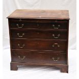 A George III mahogany bachelor's chest of drawers, with four graduating drawers, top slide on