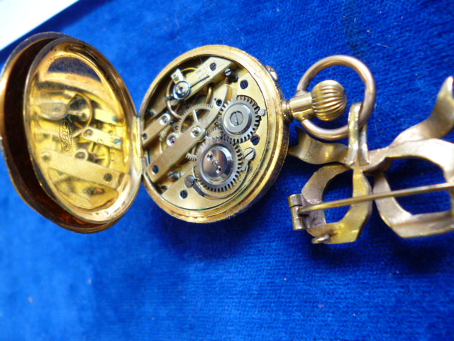 A 9ct gold ladies fob watch, by Alfred Goad & Sons, having engraved case with blue enamel Roman - Image 6 of 12