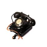 A Dutch Bakelite and enamel metal telephone, in black, printed mark to underside 2712BR13