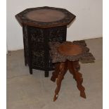 A large Indian folding table, with carved and pierced decoration, together with a smaller example (