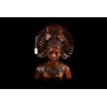 A Balinese hardwood figure bust, modelled as a young women in an ornate head dress, 34cm high