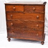 A Victorian mahogany chest of drawers, having two over three drawers, on bun feet