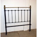 A Victorian brass and iron bed frame, the green painted iron frame having brass tops to the bed