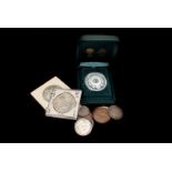 A 1881 Morgan Dollar, together with a Maria Theresia Thaler, Sydney 2000 5 Dollar proof medal,