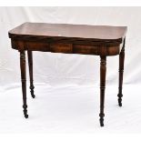 A Victorian mahogany tea table, with folding legs on turned supports on casters