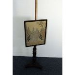 A Victorian mahogany pole fire screen, triform base with brass feet supporting turned shaft with