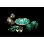 An assortment of various malachite items, to include two bangles, three necklaces, two lidded