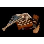 A collection of miscellineous items, to include an assortment of sea shells, a chess set, vestas,