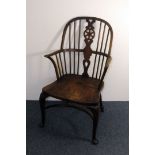 A 19th century mixed wood wheel back chair, having fad feet front supports, AF