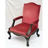 A Victorian stained wood and upholstered library chair, having red velvet seat and back with moulded