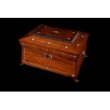 A Rosewood sewing box, of Sarcophagus shape with Lion mask handles, claw feet , mop decoration ,