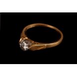 An 18ct gold diamond solitare ring, the single round cut stone, in high platinum setting on 18ct