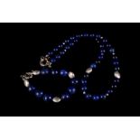 A lapis bead necklace, with matching bracelet and earrings together with lapis bead and bar
