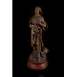 A spelter figure of Joan of Arc, mounted on faux marble wooden base, French makers mark to base (