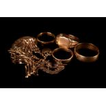 A group of four 9ct gold rings, including a signet ring, plus a 9ct gold gate link bracelet with