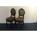 A pair of late 19th century French bedroom chairs, in gilt with rush seats and backs, AF (2)