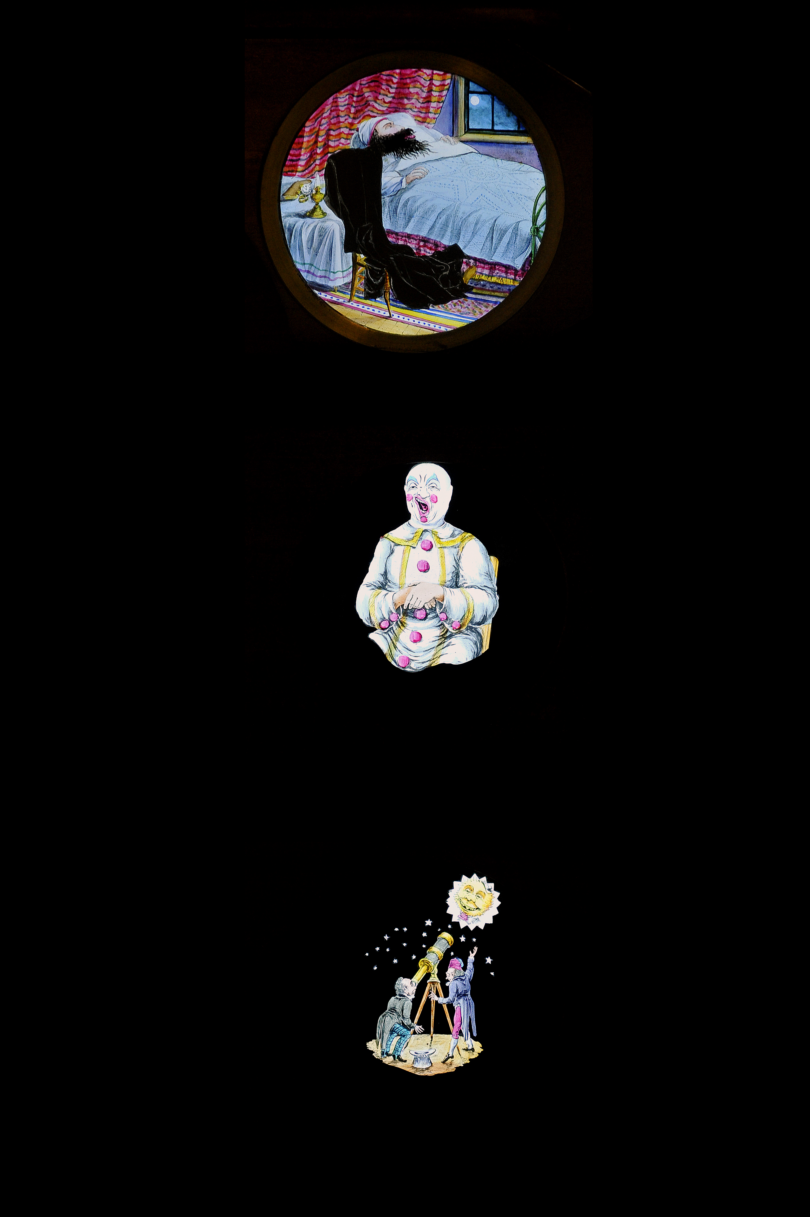 Mahogany-Mounted Hand-Coloured Rackwork Magic Lantern Slides, comic astronomer, clown with twelve