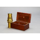 A C & F Darker lacquered brass Projecting Kaleidoscope’, in fitted mahogany case, 180mm wide,