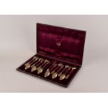 A cased set of 12 Russian silver teaspoons by Fydor Ivanov, complete with a pair of matching sugar