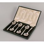 A cased set of silver soup spoons by Roberts & Belk, Sheffield 1937, plus a cased set of silver