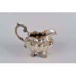 A William IV silver serpentine milk jug by Joseph Angell I and John Angell I, London 1835, with