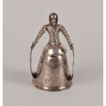 An Edwardian Dutch silver wedding cup, the bell shaped cup on articulated arms supported by a male