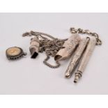 A collection of silver novelty fob chain attachments, including a matching retractable pencil and