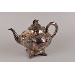 A Victorian silver melon shaped teapot by William Smily, London 1852, with floral knop to the lid