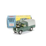 A Corgi Toys 438 Land Rover 109 WB, dark green body, grey plastic canopy, lemon interior, spun hubs,