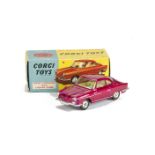 A Corgi Toys 316 NSU Sport Prinz, metallic cerise body, lemon interior, spun hubs, in original