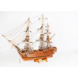 A Fine Model of Nelson’s Ship HMS Victory, constructed of wood with full rigging and folded sails,