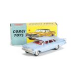 A Corgi Toys 220 Chevrolet Impala, powder blue body, red interior, spun hubs, in original box, E,