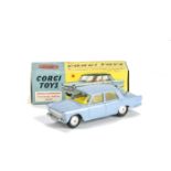 A Corgi Toys 217 Fiat 1800 Saloon, light blue body, bright yellow interior, smooth hubs, in original