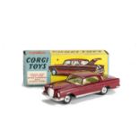 A Corgi Toys 230 Mercedes-Benz 220 SE, maroon body, lemon interior, spun hubs, in original box, E,