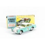 A Corgi Toys 309 Aston Martin Competition, turquoise/white body, lemon interior, RN3, spun hubs,