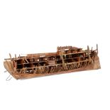 A Model of the Mary Rose as in current restoration in Portsmouth, constructed of wood and built to a