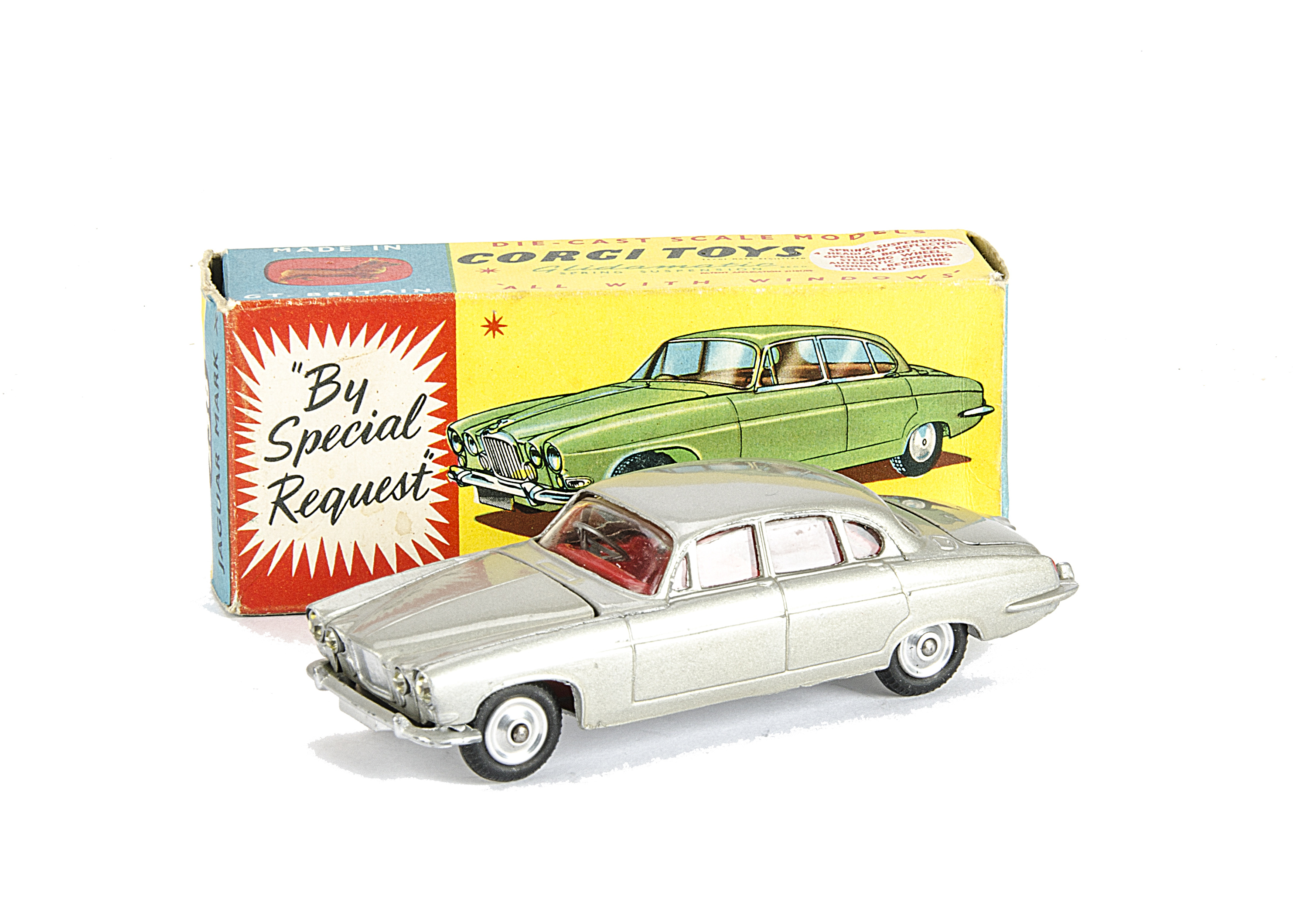 A Corgi Toys 238 Jaguar Mark X, silver body, red interior, spun hubs, two pieces of luggage, in