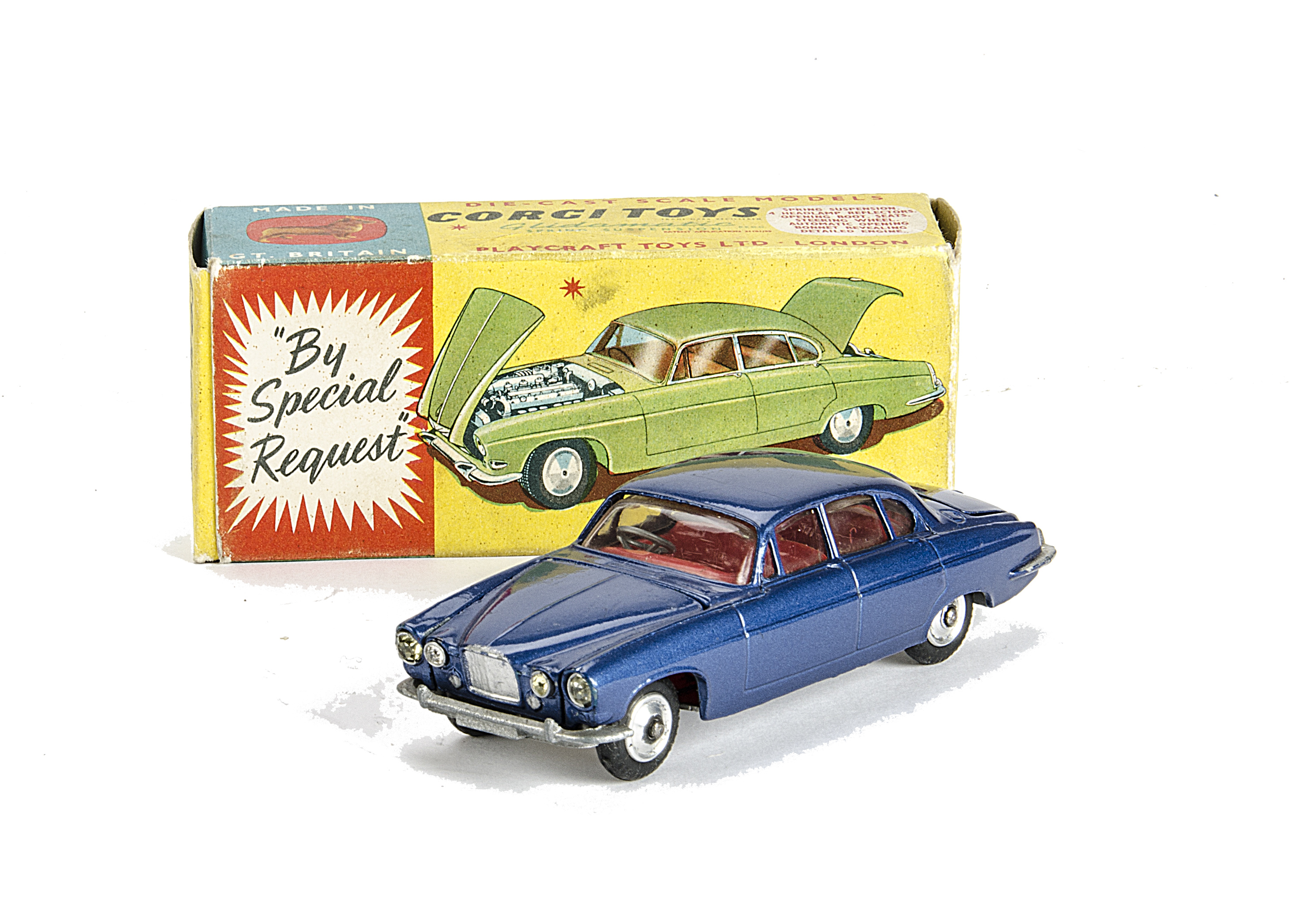 A Corgi Toys 238 Jaguar Mark X, metallic dark blue body, red interior, spun hubs, two pieces of