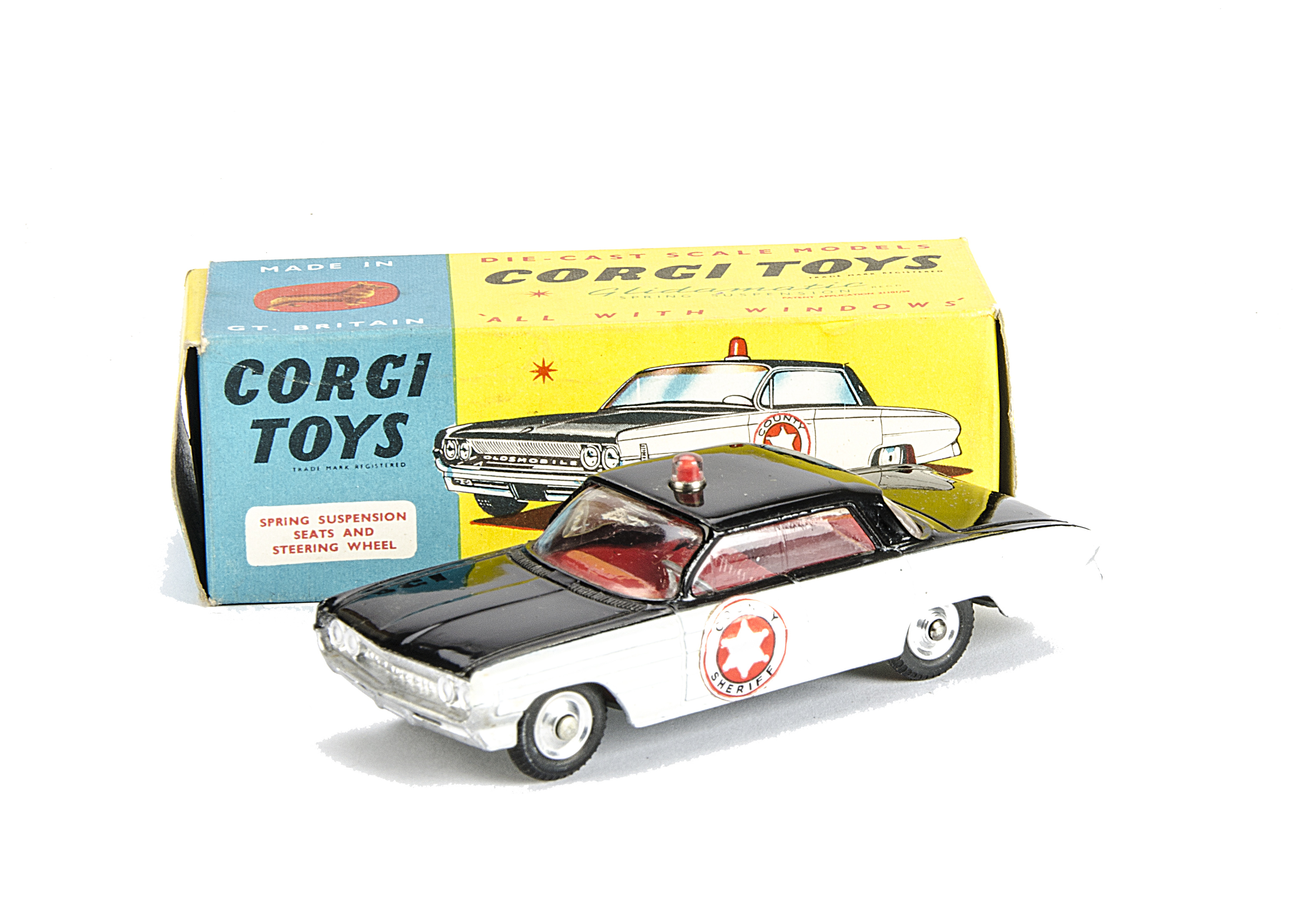 A Corgi Toys 237 Oldsmobile Sheriff Car, black body, white side panels, red interior, spun hubs,