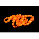 A string of vintage amber style beads, of graduated form c.1960