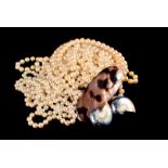 A quantity of faux pearl and shell jewellery, including multi-strings of fine beadwork, filled shell
