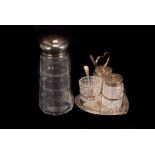 An Edwardian silver and cut glass cruet set, on heart shaped stand with handle, having cut glass