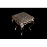 A late 19th century Continental silver miniature table, in the rococo taste, bearing British