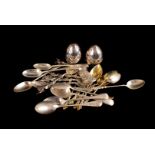 A collection of silver and silver plated teaspoons, together with a pair of George V silver weighted