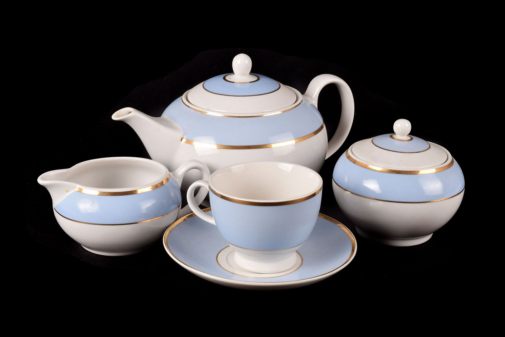 A Doulton part Tea set, of blue and gilt hoop design, consisting of Teapot, cream, sugar, four